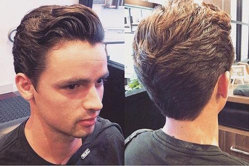 combed back curly hairstyle for men