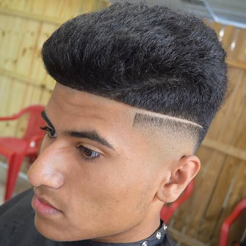 high top haircut with fade and shaved part